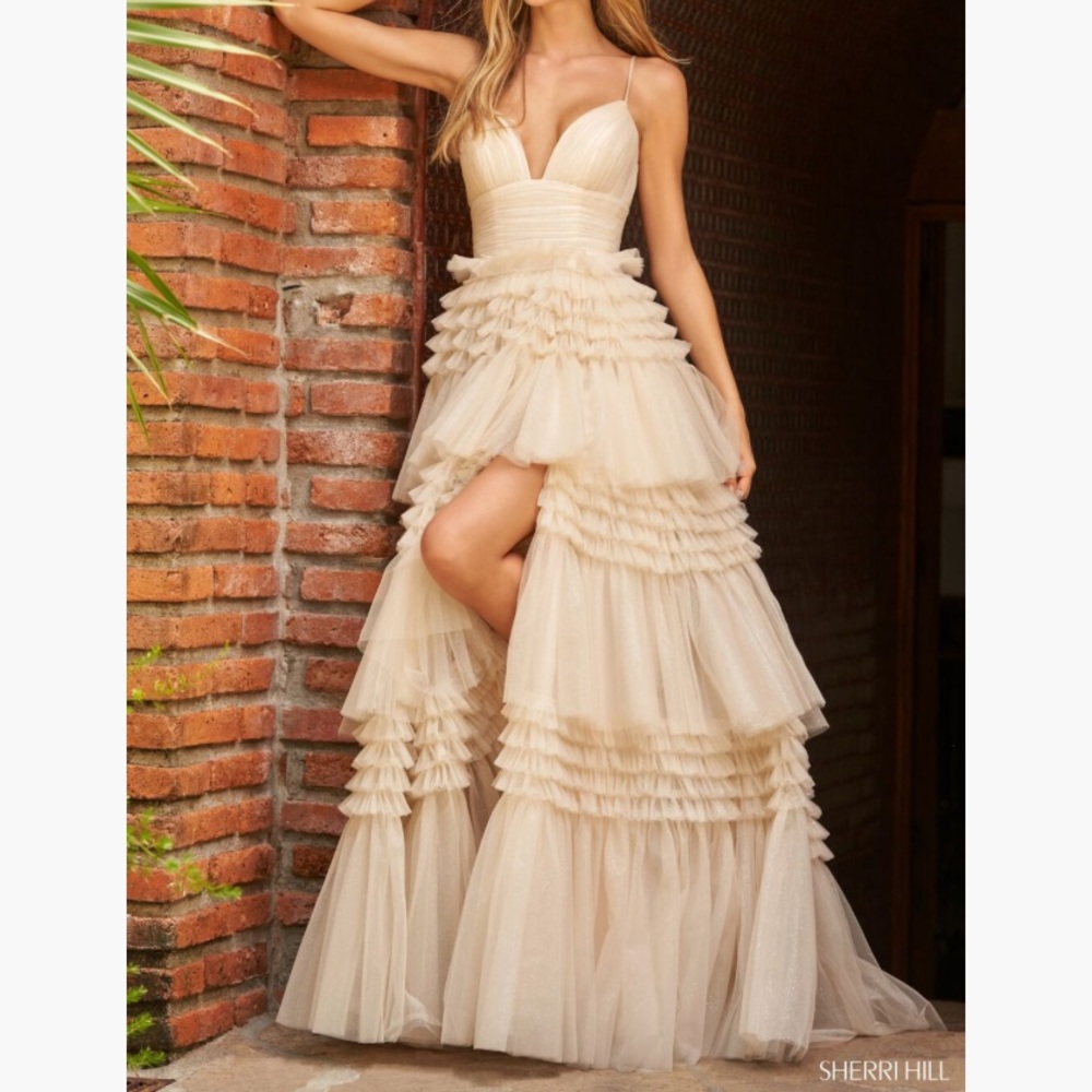 Black Sherri Hill tulle tiered black dress that sparkles under stage lights.